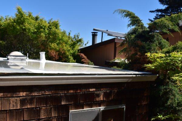 Roof corner after 48 hours showing the raised edge they installed on the roof also showing shoddy installation