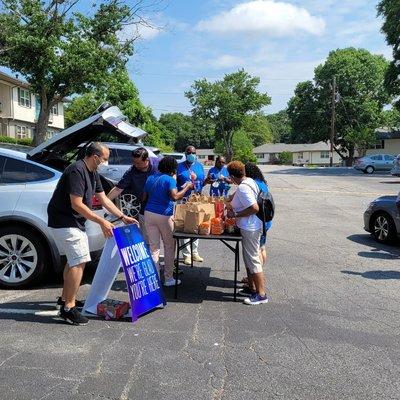 Giving out food stuffs to our community