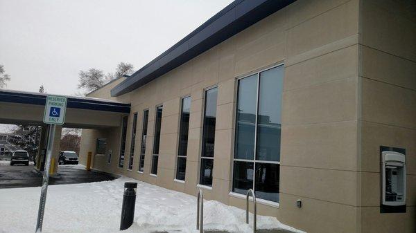 Side of building facing away from South State Street. Drive-thru banking lanes to the left of photo view.