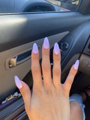 oval shaped lavender acrylic nails.