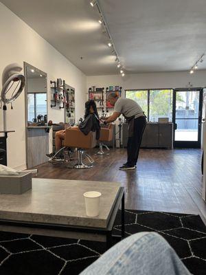 My husband getting his hair trimmed.