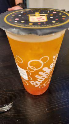 Passion fruit green tea with strawberry popping boba