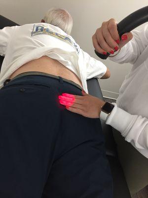 Certified laser technician working on a client's back pain. Specializing in pain management and reducing inflammation in the body!