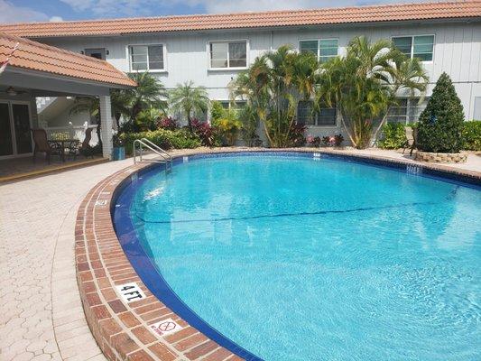 Recently redone heated pool in tropical courtyard setting