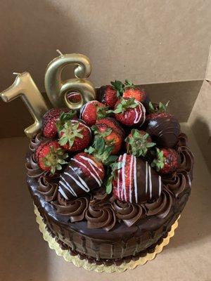 3-layered double chocolate cake with strawberry filling and chocolate covered strawberries