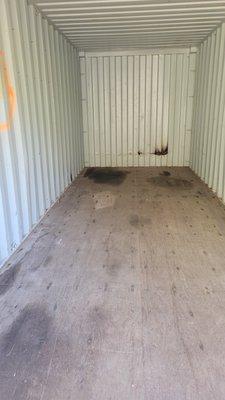 Photo shows big wet spot in the floor of container