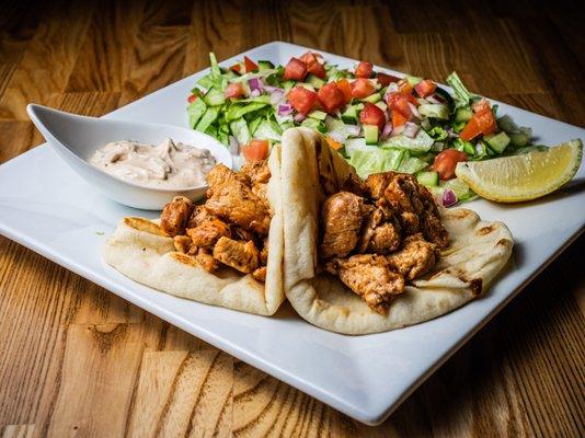 Mediterranean style chicken, served with pita & tahini yogurt sauce, lettuce, cucumber, tomato, red onion