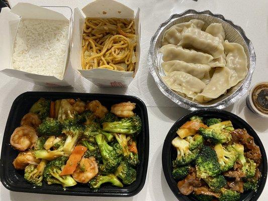 Shrimp and broccoli, beef and broccoli, rice, noodles, dumplings with sauce.