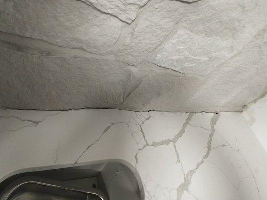 Our installer guys did an awesome job curving the Quartz to match this customer's brick wall.