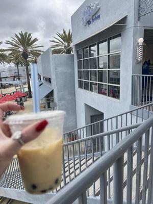 Bobba jasmine milk tea and the front of the restaurant