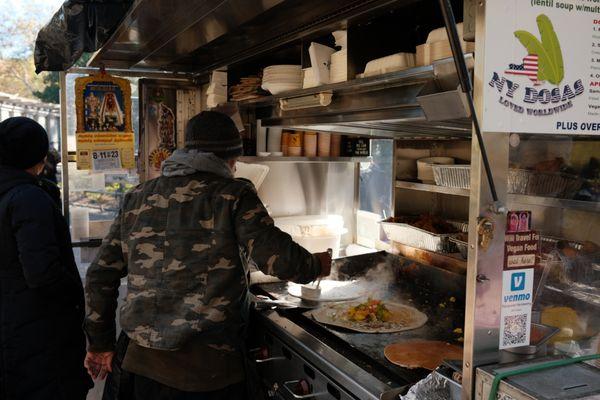 The owner cooking at his stand