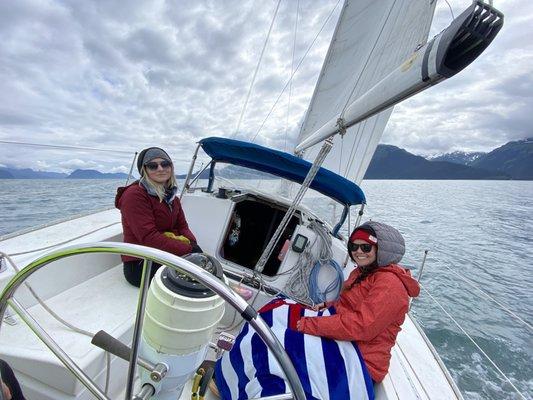 The wind can make for some chilly summer days out sailing. Bring layers!