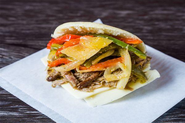 Carnitas Arepa: Oven Roasted Pork, Sautéed Vegetables, Mozzarella Cheese