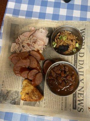 Two meat plate with Turkey and sausage pinto beans and dirty rice