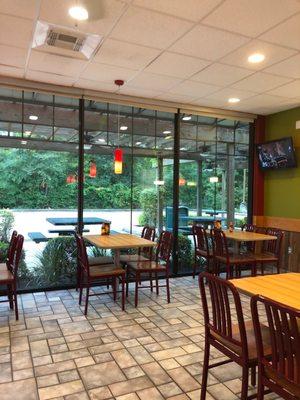 Nice outdoor patio area with ceiling fans and partially covered.