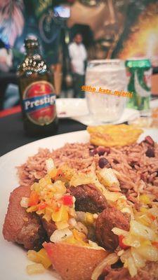 Griot, rice, plantains and Prestige (delicious Haitian beer)