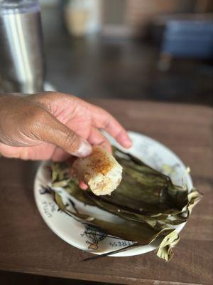 Banana with sweet rice wrapped with banana leaf