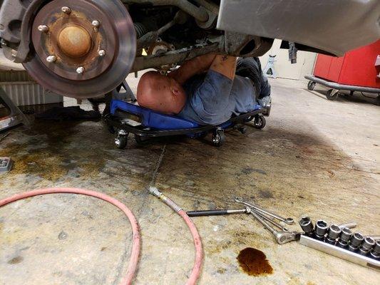 Our mechanic hard at work on a vehicle.