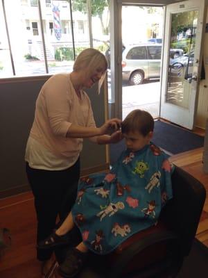 My little guy getting the best cut of his life!