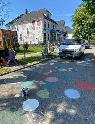 Each spot on the road was painted by a different visitor at Tyree's request