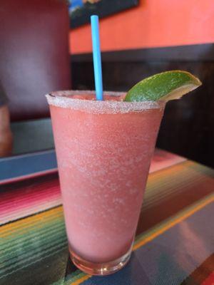 Strawberry margarita blended with sugar on rim