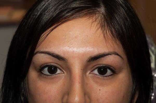 Natural looking eyeliner on both top and bottom lash lines.