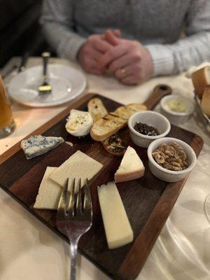 Example of our cheese board. They have several cheeses, meats, and olives to mix and match.