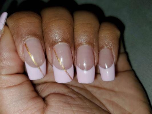 Pastel pink french tips with gold streak by Henry