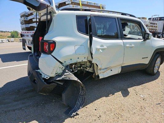 Yikes! Despite the damage, my car was delivered promptly to the body shop.