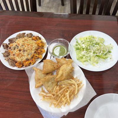 Grilled meat with rice, you can get it with bread instead if you'd like.