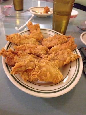 Fried shrimp with sweet and sour sauce on the side.