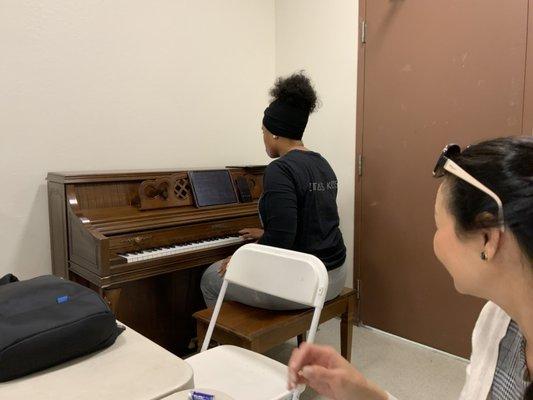 Annastasia Diamond on the piano to help us practice for the Deaconate Ordination at St Joseph.