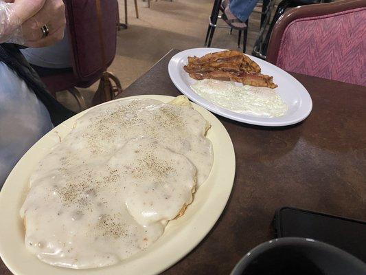 Biscuits and gravy, eggs over easy and bacon