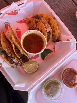 Cheesy birria tacos with consume