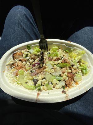 The bowl is BARELY filled up halfways. About 8 pieces of small chicken in the entire bowl. And half scoops of rice & beans.