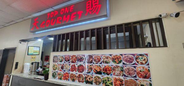 Different restaurants inside food court.