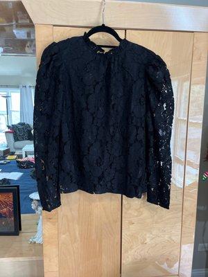 A really pretty and unique black lace blouse.