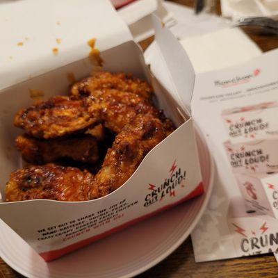 6 wings and 3 drums in a box with Korean BBQ sauce..