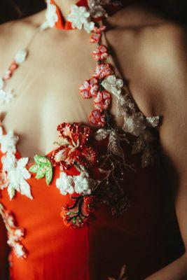 Thuy hand sewed each floral applique and designed the placement on the dress.