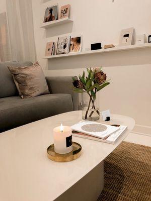 Seating area with their candles and magazines