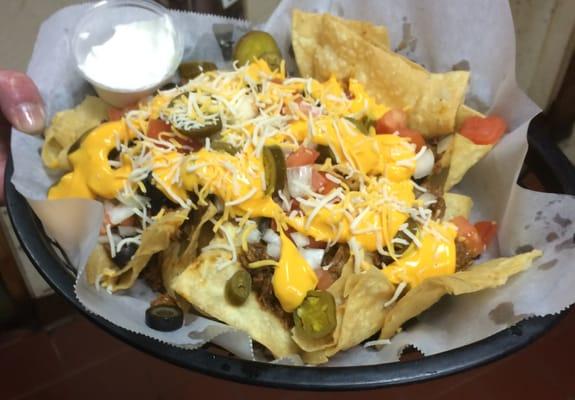 Loaded nachos, they use homemade chips and they were still hot!