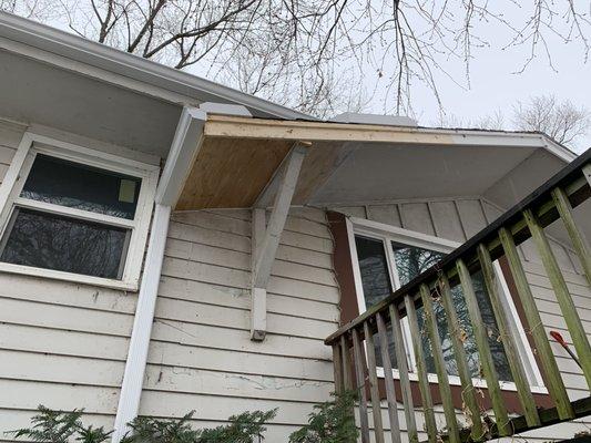 Rebuilt gable end. Two pieces of soffit, sub fascia, fascia and trim installed.