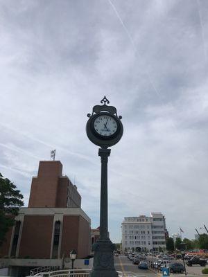 Clock in the courtyard between buildings