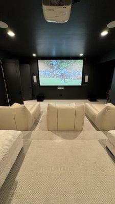 Movie room installation with 135" screen and Klipsch speaker system