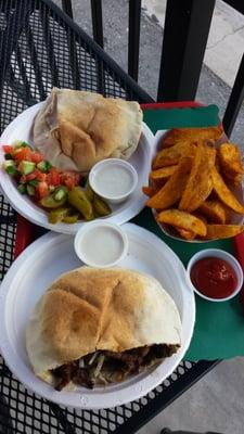 Beef shawarma with a side of fries.