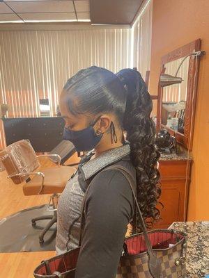 Ponytail with loose wand curls