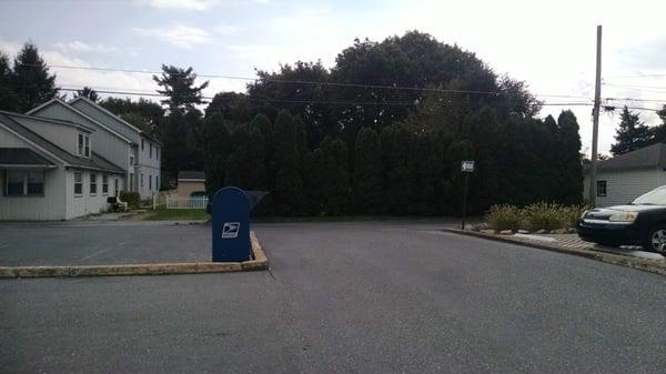 back parking lot with drop-off mailbox