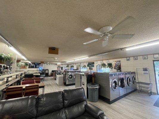 Desks, hanging plants, huge washers and dryers, couch, etc.. street signs give it charm.