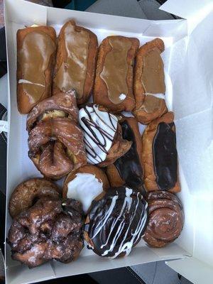 Maple filled custard long john, chocolate custard, Black n white cream filled, cinnamon roll, apple fritter, and jelly filled.