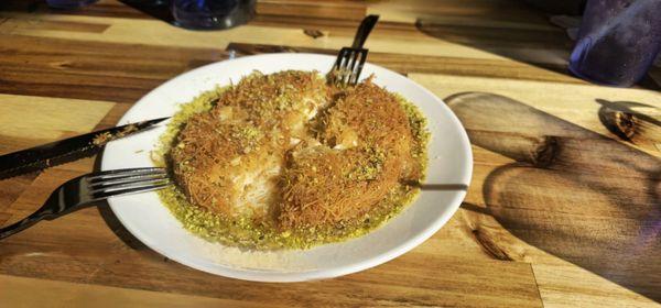 Kunefe- crispy cheese-filled dessert made with kadayıf (kah-dah-YUF'), which is a traditional shredded wheat dessert with pistachio filling.